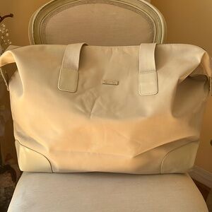 Burberry fragrance duffel bag.